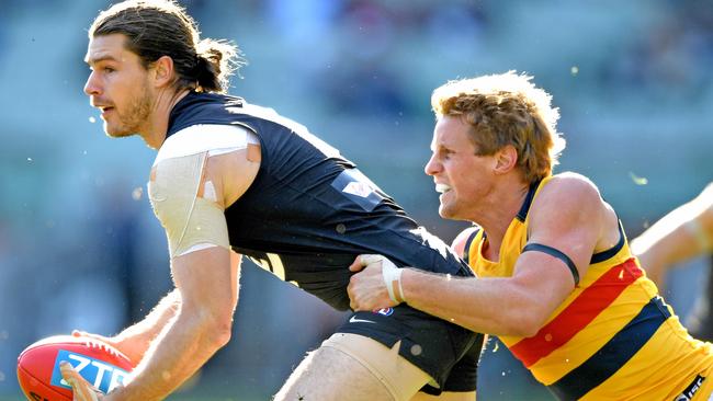 IN THE FRAME: Adelaide could make a late-trade move on contracted Carlton midfielder Bryce Gibbs to close a deal with Brisbane on Charlie Cameron and as insurance should vice-captain Rory Sloane, right, take up free agency next year. Picture: Joe Castro.