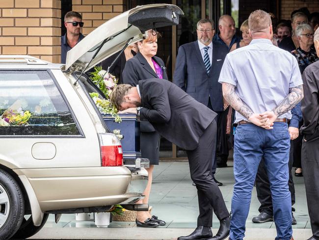 The funeral Service to celebrate the life of murdered Dr. Ash Gordon takes place at Kernot Hall, Morwell. The drs best friend Tristen Standing kisses the coffin. Picture: Jake Nowakowski