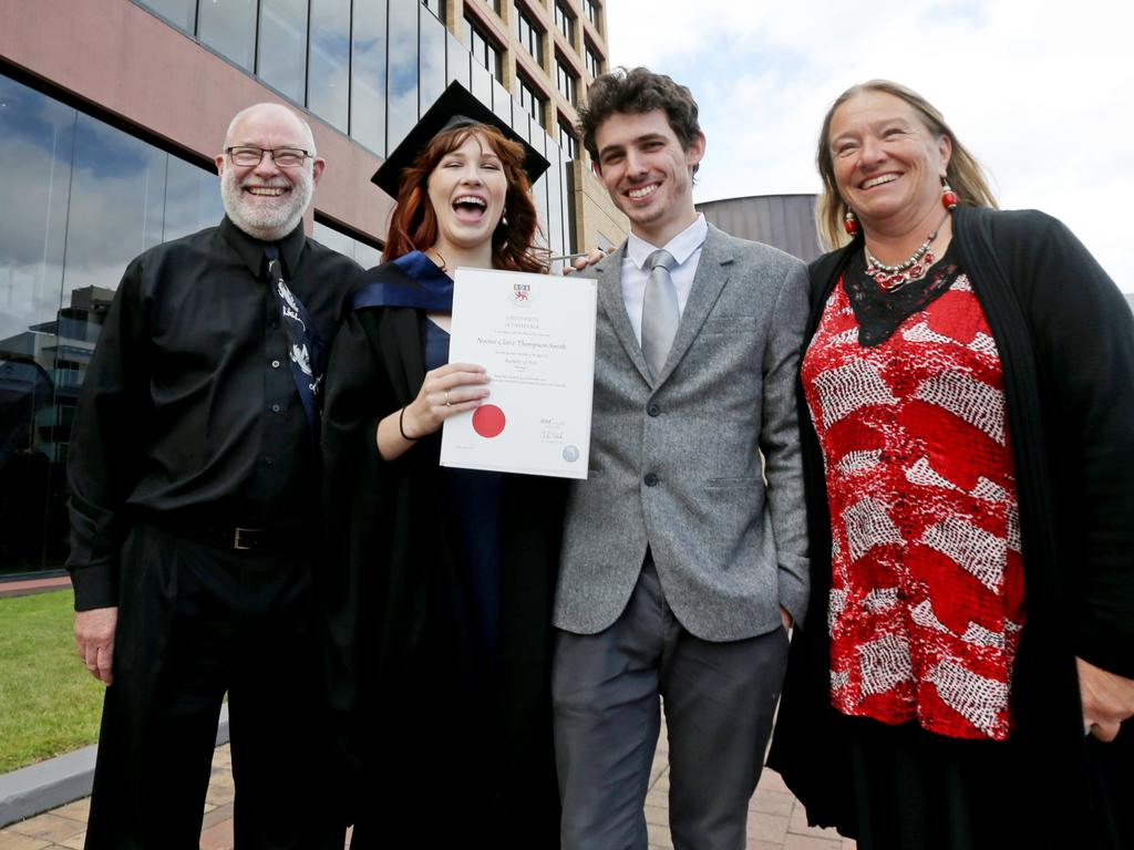 Bachelor of Arts graduate Naomi Thompson with her husband Brodie Thompson and proud parents David and Merran Dieckfoss. Picture: PATRICK GEE