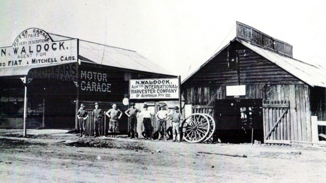 Waldock’s Motor Garage at the lower end of Lamb Street, Murgon, ca. 1918. Selling Ford, Fiat, and Mitchell cars, it sat alongside a blacksmith shop, blending old and new industries. Source: QldPics