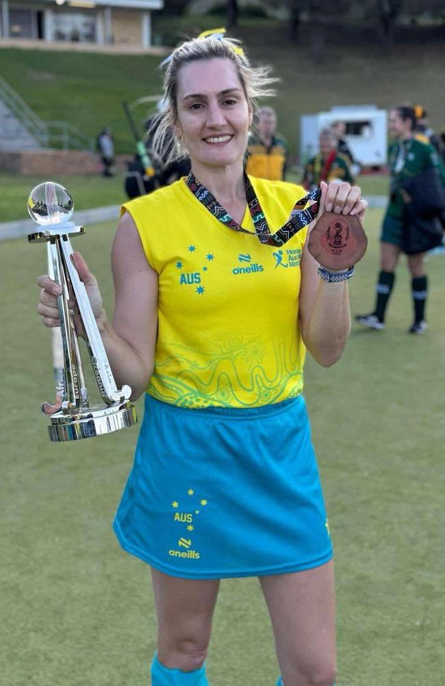 Chané Mellon with the International Masters Cup trophy and her medal. Picture: Supplied