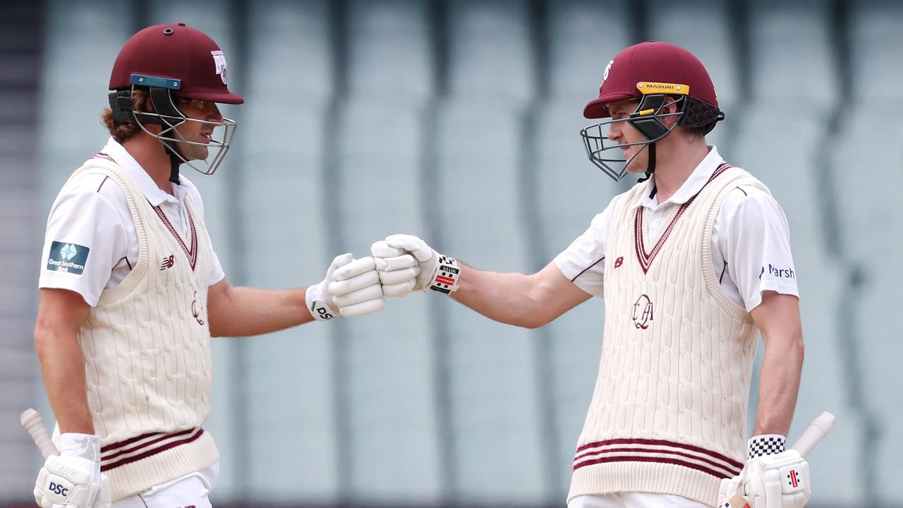 Joe Burns of the Queensland Bulls congratulates Jack Clayton. Photo by Sarah Reed/Getty Images