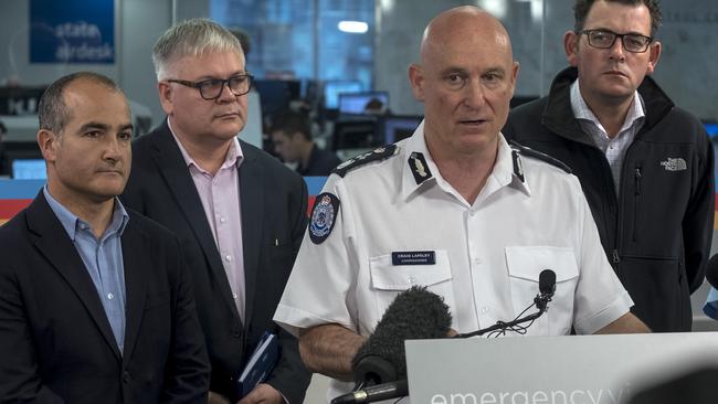 Victoria's Emergency Management Commissioner Craig Lapsley, Victorian Premier Daniel Andrews and Dr Andrew Tupper, from the Bureau of Meteorology. Picture: AAP /Luis Enrique Ascui.