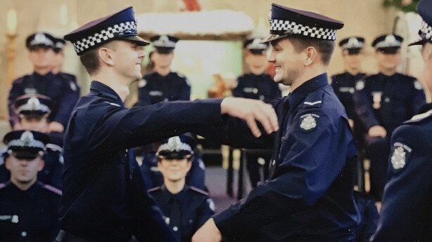 Josh being congratulated by brother Alex on his graduation day in December 2019. Picture: Supplied