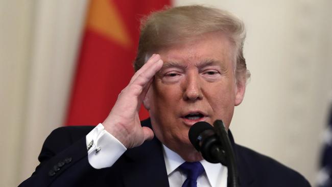 President Donald Trump speaks before signing a trade agreement with Chinese Vice Premier Liu He, in the East Room of the White House.