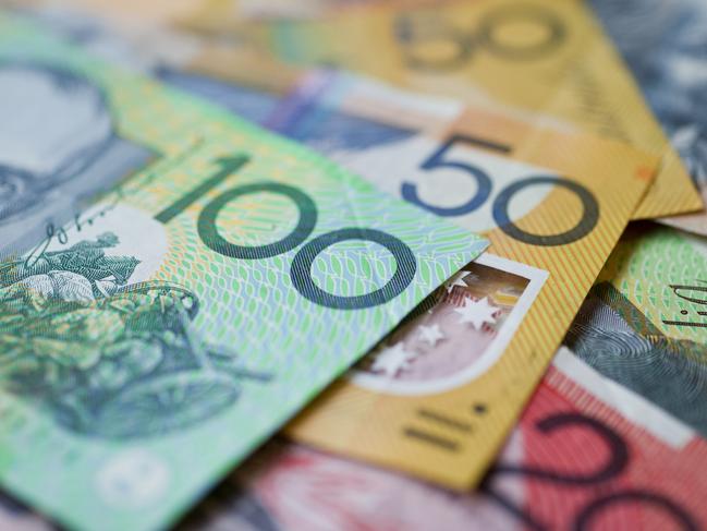 Australian money background showing $100, $50 and $20 notes with a shallow depth of field.