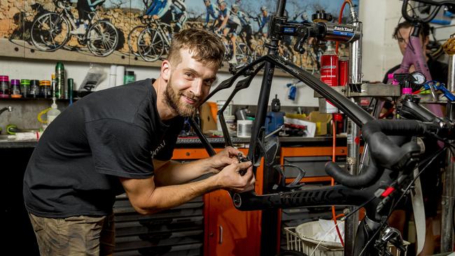 Bicycle mechanic Stefan Sojeci hard at work. Picture: Jerad Williams