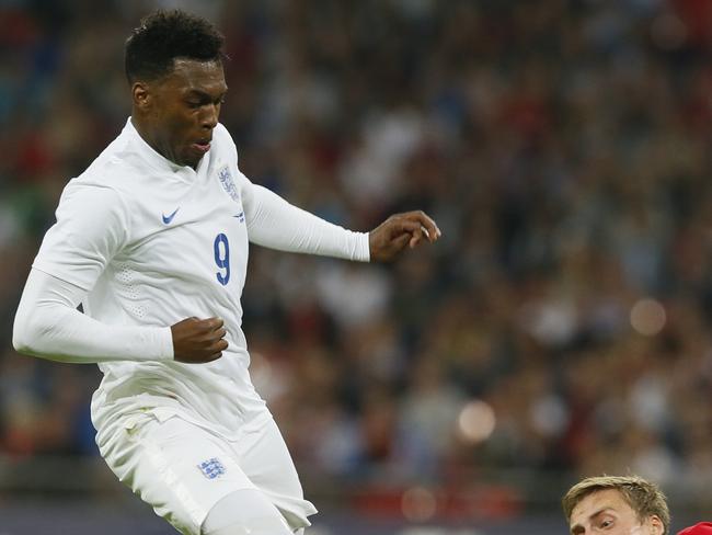 England's Daniel Sturridge, left, is tackled by Norway's Vegard Forren during the international friendly soccer match between England and Norway at Wembley Stadium in London, Wednesday, Sept. 3, 2014. (AP Photo/Alastair Grant)