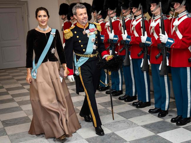 Crown Prince Frederik of Denmark and Crown Princess Mary of Denmark review an honour guard as they arrive to the New Year's event for officers from the Armed Forces and the National Emergency Management Agency. Picture: AFP