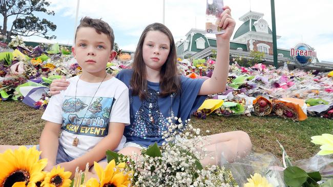 Ava and Hamish Henderson at the Dreamworld front gate which became a focal point for the grieving community.