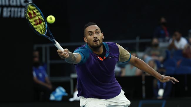 Australia’s Nick Kyrgios stretches out during his five-set third round loss to Austria’s Dominic Thiem at Melbourne Park on Friday night. Picture: Getty Images