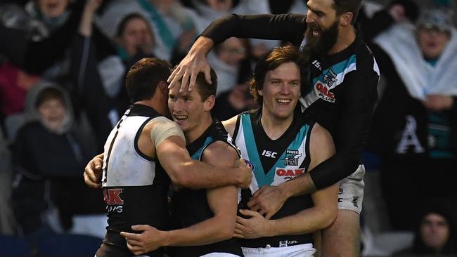 Travis Boak, Kane Farrell, Jared Polec and Justin Westoff celebrate Farrell’s first goal at AFL in level in Round 19, 2018. Picture: Julian Smith/AAP