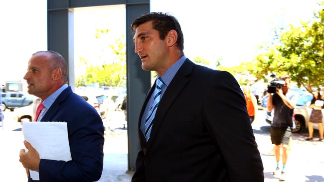 A low point — former Gold Coast Titans player Dave Taylor in Southport Court with his lawyer Campbell McCallum Photo: David Clark