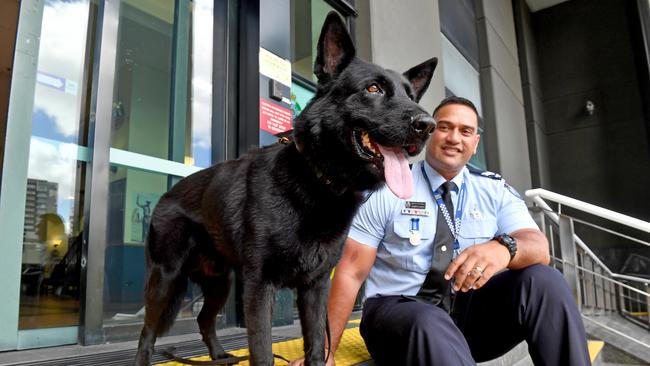 Senior Constable Joe Alofipo with PD Bravo outside Police Headquarters. Picture: John Gass