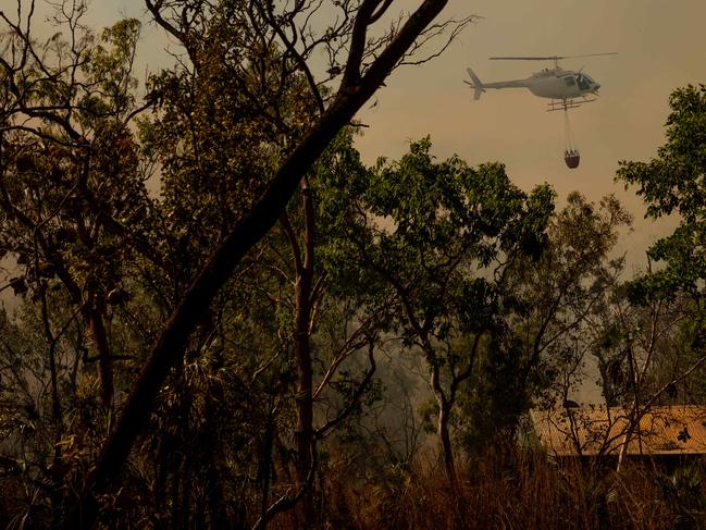 Darwin's rural areas have seen a series of bushfires  during the NT's worst fire rating days of the past two years. More extreme fire days are expected later in the week. A bushfire threatens homes and properties in the idyllic Lake Bennett region. Multiple helicopters and volunteer fire fighting units battled the blaze for two days.Picture: Che Chorley