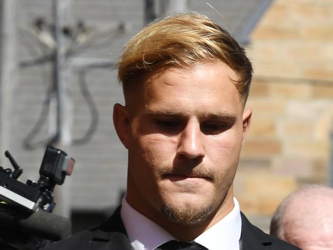 St. George Illawarra Dragons player Jack de Belin (left) leaves Wollongong Local Court in Wollongong, Tuesday, February 12, 2019. (AAP Image/Dean Lewins) NO ARCHIVING