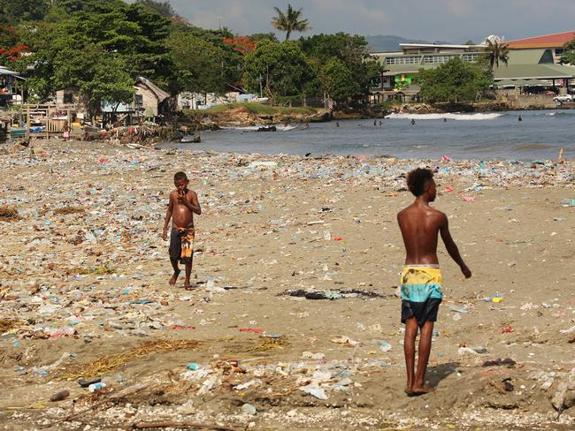 Less than 4km from the centre of town and the Australian High Commission, children and families wash and swim in sewage and rubbish in Honiara, Solomon Islands.