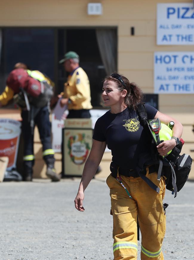 Personnel from the ACT Rural Fire Service head out from The Great Lakes store to the fire front near Miena. Picture: LUKE BOWDEN