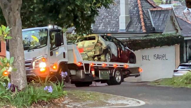 A damaged car is towed from the scene. Picture: NewsWire