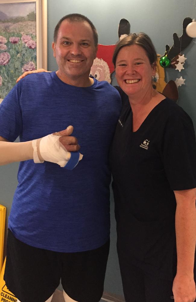 Darren Hopkins with burns nurse Rebecca Schrale while he was undergoing treatment at the Tasmanian Burns Unit at the Royal Hobart Hospital. Picture: Supplied