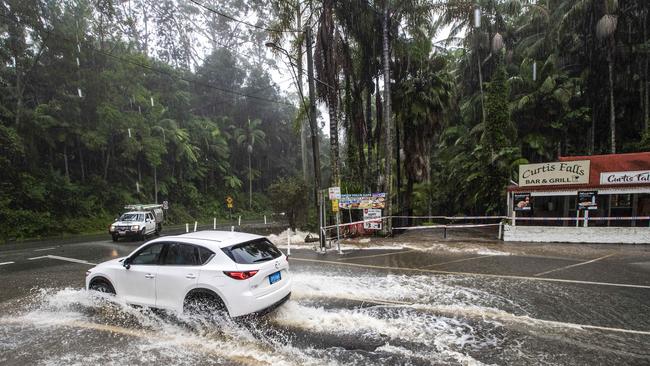 Drivers at Tamborine Mountain during the severe weather event. Motorists should keep clear of flood-affected roads. Picture: Nigel Hallett.