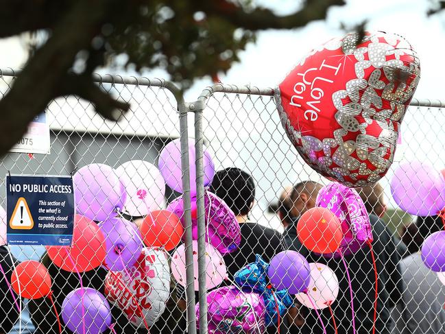 Balloons are seen as family and friends of victims of the White Island eruption gather in Whakatane. Picture: Getty Images