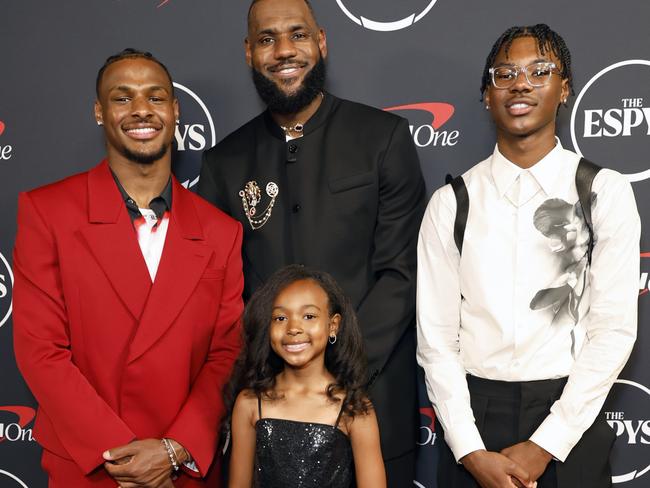 LeBron (centre) with his children Bronny (left), Zhuri (centre) and Bryce (right). Picture: Frazer Harrison/Getty Images