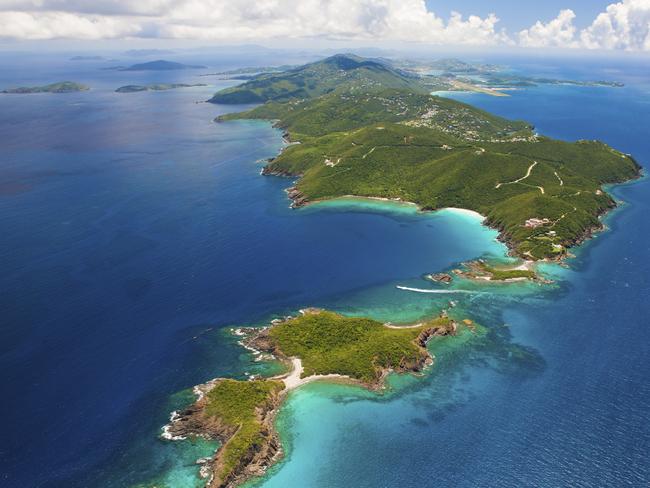 aerial shot of East End, St. Thomas in US Virgin Islands in the foregound, St. John, USVI and Tortola, BVI on the horizon; taken from a light aircraft