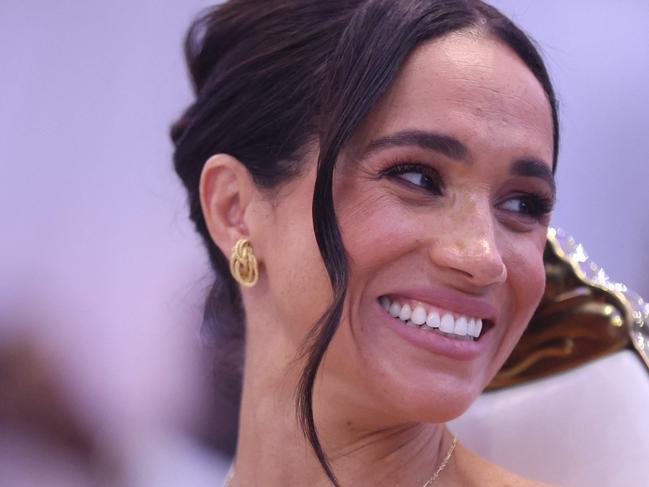 Britain's Meghan, Duchess of Sussex, looks on as she attends a Sit Out with Britain's Prince Harry (unseen), Duke of Sussex, at the Nigerian Defence Headquarters in Abuja on May 11, 2024 as they visit Nigeria as part of celebrations of Invictus Games anniversary. (Photo by Kola SULAIMON / AFP)