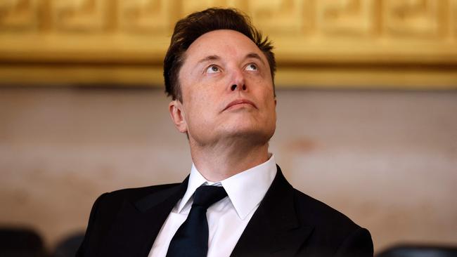 (FILES) Telsa, SpaceX and X CEO Elon Musk looks on ahead of the inauguration ceremony where Donald Trump will sworn in as the 47th US President in the US Capitol Rotunda in Washington, DC, on January 20, 2025. Musk attacked the US Agency for International Development (USAID) on February 2, 2025, calling it a "criminal organization" after Donald Trump moved to freeze the bulk of Washington's foreign assistance for three months. (Photo by Chip Somodevilla / POOL / AFP)