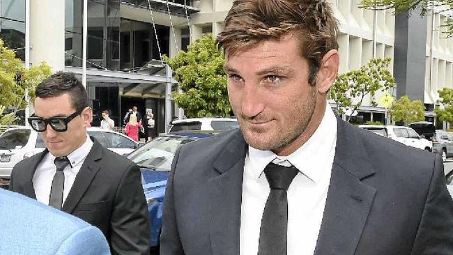 TRYING TIMES: Former Gold Coast Titan Dave Taylor leaves the Southport Magistrates Court yesterday after being committed to stand trial. Picture: DAN PELEDAAP