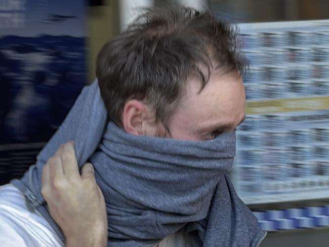 Christopher John Duff leaving Waverley Police Station after being granted bail. He allegedly accessed almost 9000 court documents between January and March 2025.
