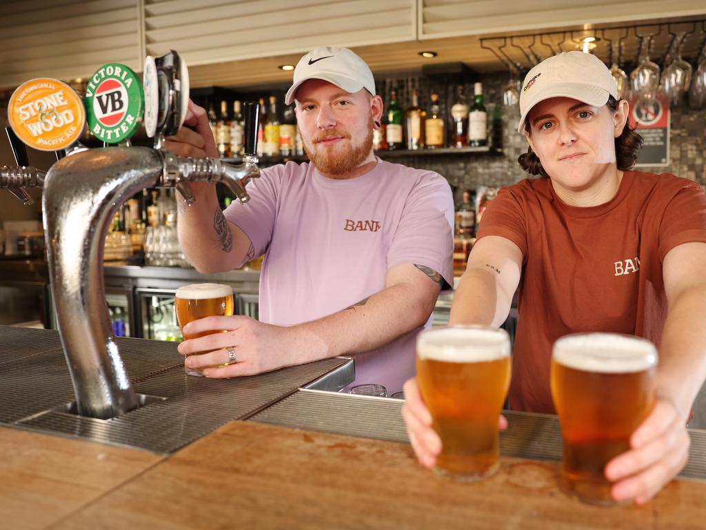 Duty Manager and Bar Tender Adam Tabacchi and Bartender Emily McCaig at The Bank in Newtown, which was impacted by a slowdown in trade during the rail chaos. Picture: Rohan Kelly