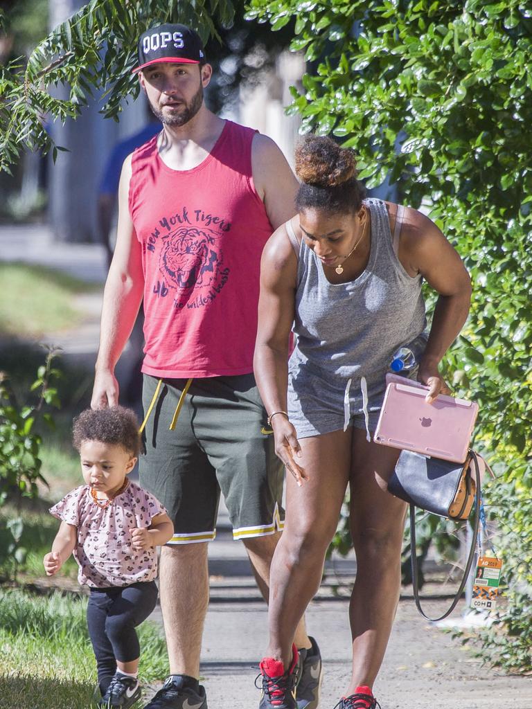 Serena Williams and her husband Alexis Ohanian enjoy an afternoon walk with their 1-year-old daughter Alexia Olympia. Serena's daughter looked seriously cute, toddling her way down the footpath, wearing Nike sneakers like her Mummy. Picture: MediaMode