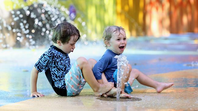 Cairns is currently experiencing fine weather, with warm sunny days and pleasant nights. Leano Casutt, 4, and his brother Jaron Casutt, 2, cool off from the warm temperatures by splashing about at Muddie's Playground on the Cairns Esplanade. Picture: Brendan Radke