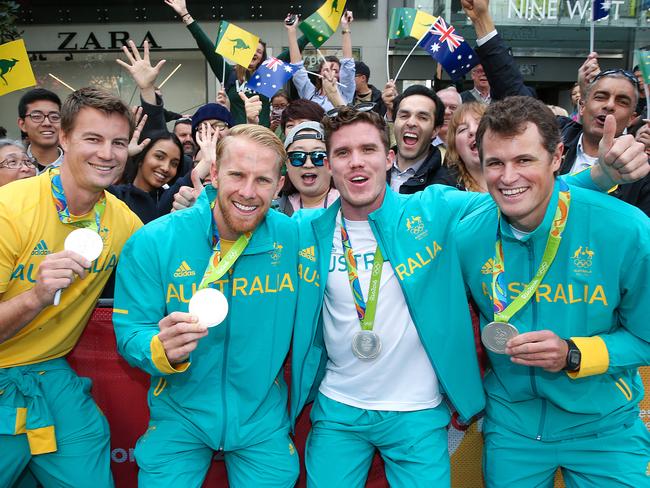 Mens rowing silver medallists James McRae, Cameron Girdlestone, Alexander Belonogoff and Karsten Forsterling soak in the atmosphere at Melbourne’s last Olympians parade in 2016. Picture:Ian Currie