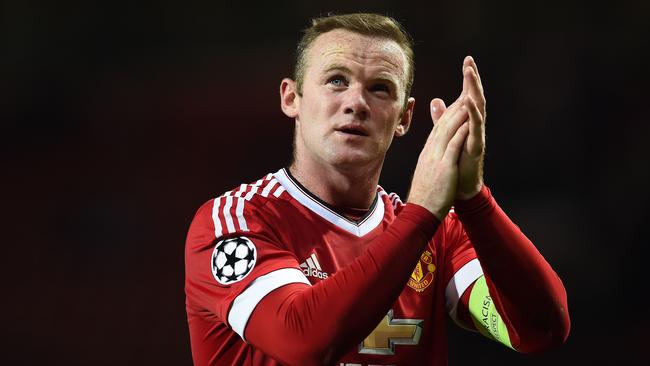 (FILES) A file photo taken on September 30, 2015, shows Manchester United's English forward Wayne Rooney as he applauds the fans following the UEFA Champions League Group B football match between Manchester United and VfL Wolfsburg at Old Trafford in Manchester, north west England. Manchester United won the match 2-1. Ahead of his 30th birthday on October 24, 2015, the view of Wayne Rooney as a player whose career, though hugely successful, never quite fulfilled its early promise is being quietly reappraised. AFP PHOTO / PAUL ELLIS