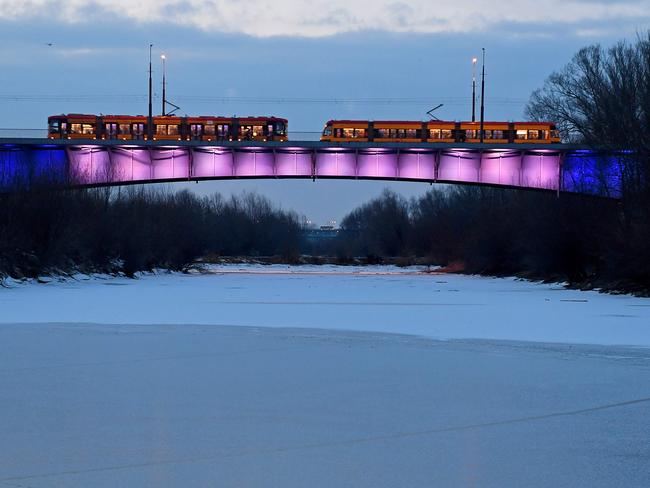 Tramways cross a bridge over the partially frozen Vistula river on February 27, 2018 in the Polish capital Warsaw. A blast of Siberian weather sent temperatures plunging across much of Europe, carpeting palm-lined beaches in snow and prompting warnings for the homeless and elderly people. Picture: AFP