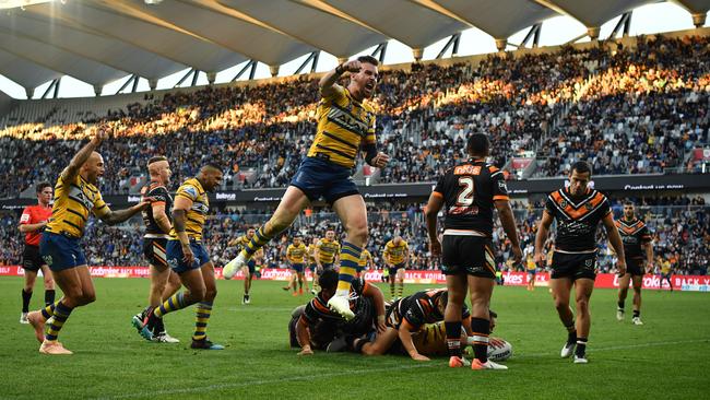 Clint Gutherson jumps for joy as Brad Takairangi scores a try. Picture: AAP