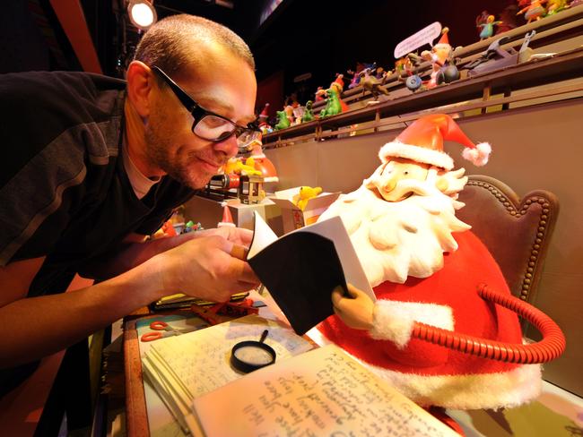 2008: English author Alan Snow’s book How Santa Really Works inspired this year’s Myer Christmas windows. Propmaker Tim Wells puts the finishing touches on one of the displays. Picture: News Limited