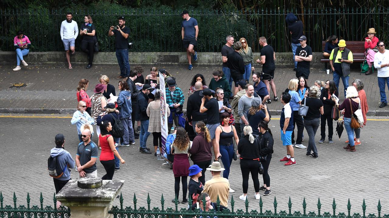 A gathering of maskless people outside the fence of Parliament House, while it was placed into lockdown during sitting due to a threat of an intrusion. Picture: NCA NewsWire / Dan Peled