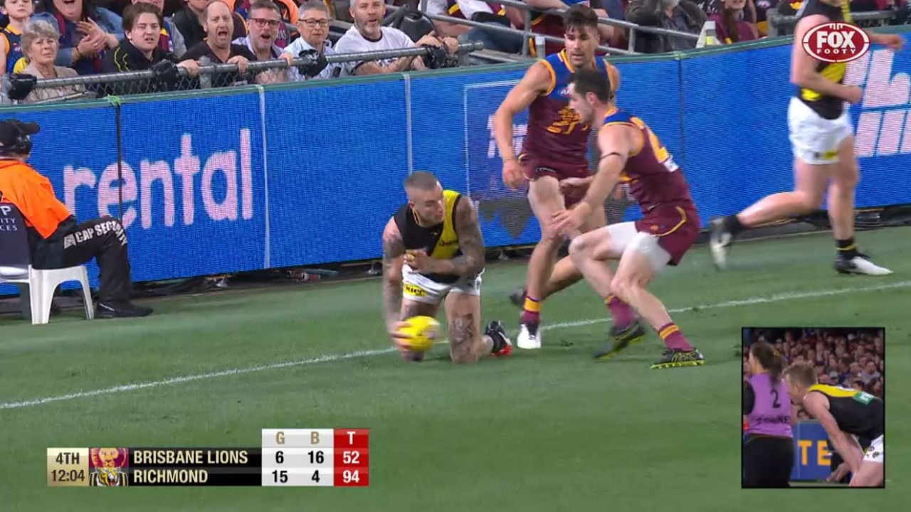 Dustin Martin helps the ball along - perhaps it was a throw - against Brisbane.