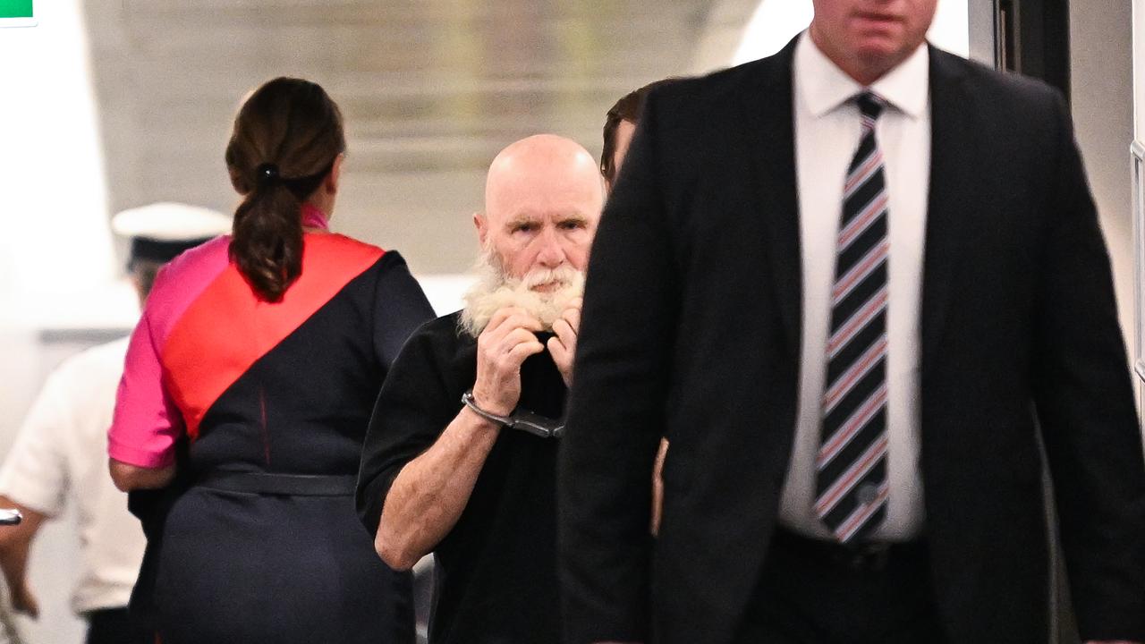 Keith Lees arrives at Brisbane Domestic Airport following his extradition from Sydney. Picture: Dan Peled / NewsWire