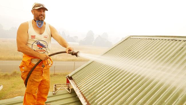 David “Chunky” Reynolds is staying to defend his home on Arve Rd in Geeveston. Picture: RICHARD JUPE