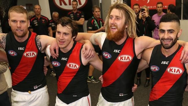 Essendon players celebrate the win over West Coast.