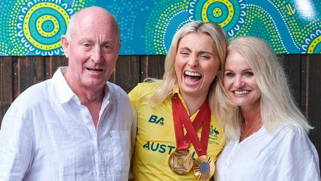 Australia's golden Paris paralympian,  swimmer Alexa Leary celebrating with her parents, Russell and Belinda in the French capital on September 5, 2024. Photo: Jacquelin Magnay