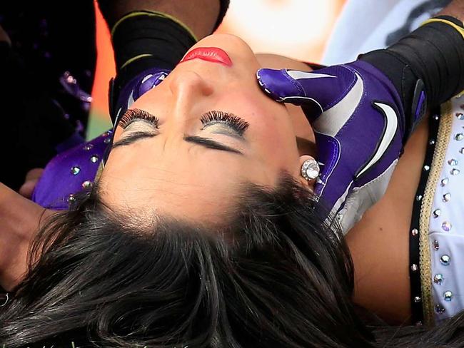 BALTIMORE, MD - NOVEMBER 09: A Ravens cheerleader is tended to after falling during a game between the Baltimore Ravens and Tennessee Titans at M&T Bank Stadium on November 9, 2014 in Baltimore, Maryland. Rob Carr/Getty Images/AFP == FOR NEWSPAPERS, INTERNET, TELCOS & TELEVISION USE ONLY ==
