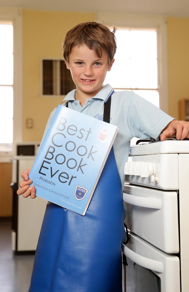 Harry Chase, 10, with the cookbook he designed. Picture: Jonathan Ng