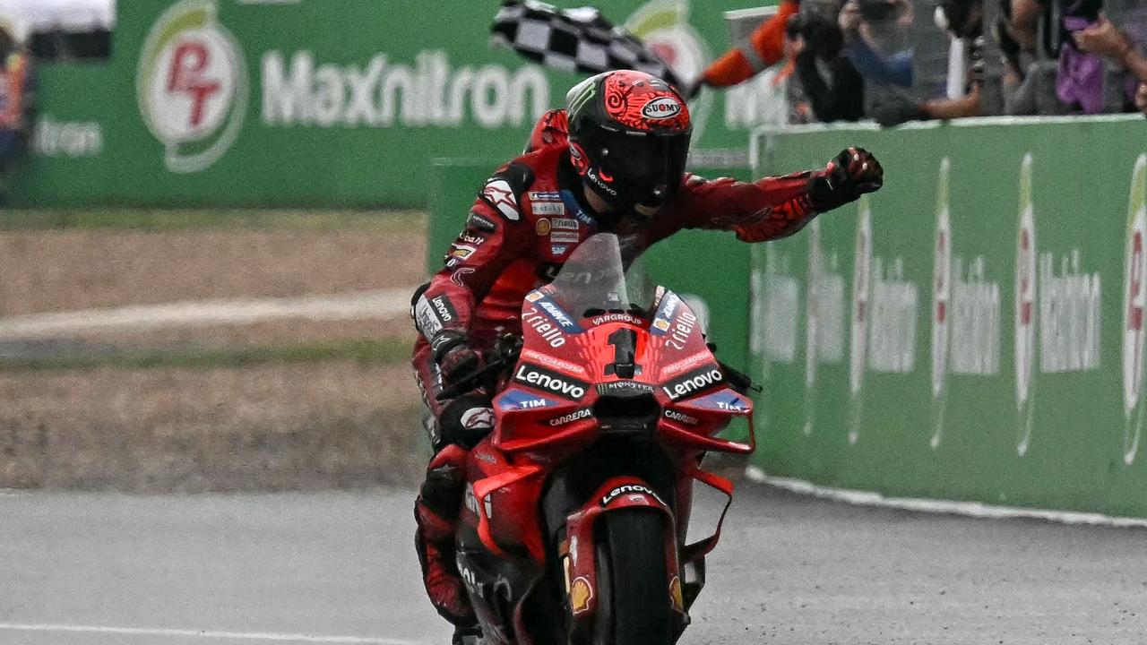 Ducati Lenovo Team's Italian rider Francesco Bagnaia celebrates winning the MotoGP Thailand Grand Prix at the Buriram International Circuit in Buriram on October 27, 2024. (Photo by Lillian SUWANRUMPHA / AFP)