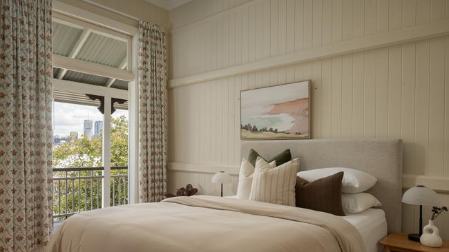 Glimpses of the city from one of four bedrooms, opening onto the wraparound veranda.